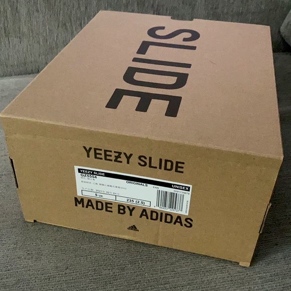 Yeezy slides in “pure” in a US mens 5